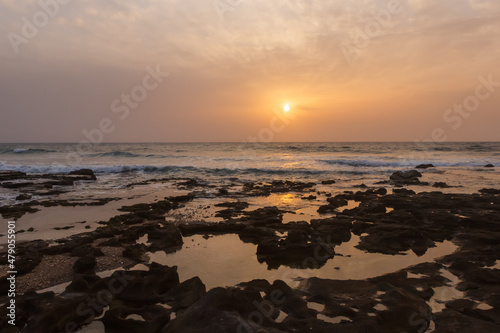 foggy sunset on the beach near haifa
