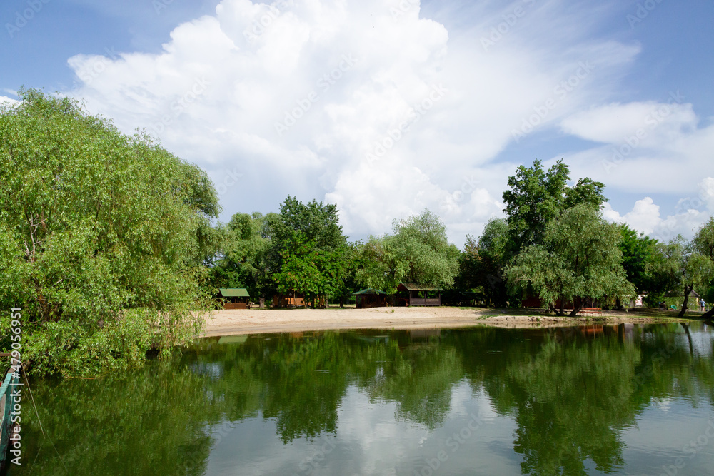 Summer landscape at the beach with gazebos and trees Summer landscape at the beach with gazebos and trees