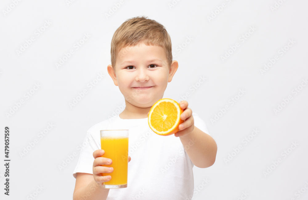 Little boy having a glass of refreshing oranges juice - isolated on white Little boy having a glass of refreshing oranges juice - isolated on white
