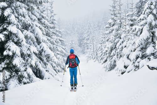 Skitury, skituring, zimowe wędrówki górskie na nartach do skituringu, piękna biała zima w górach, śnieg w Karkonoszach, ferie zimowe. Skitouring in Polish mountains, white winter. photo