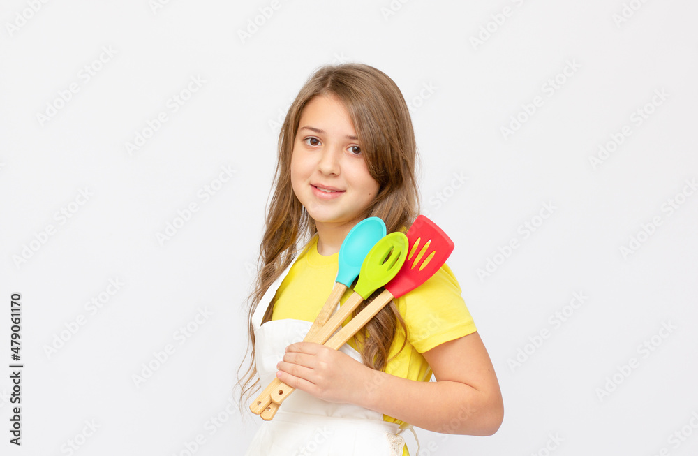 Beautiful little girl in chef uniform isolated on white Beautiful little girl in chef uniform isolated on white