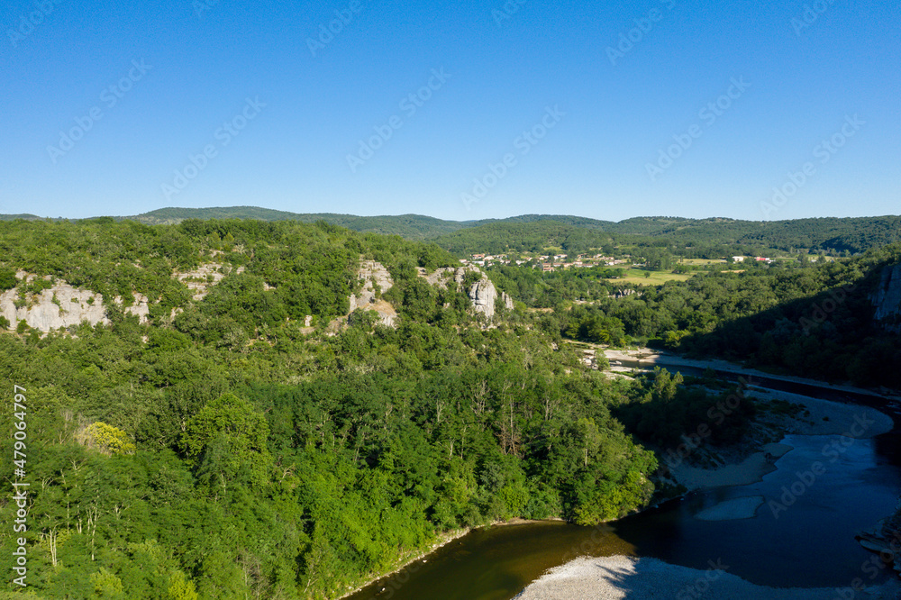 The Gorges de lArdeche and its river in the middle of forests in Europe, France, Ardeche, in summer, on a sunny day.