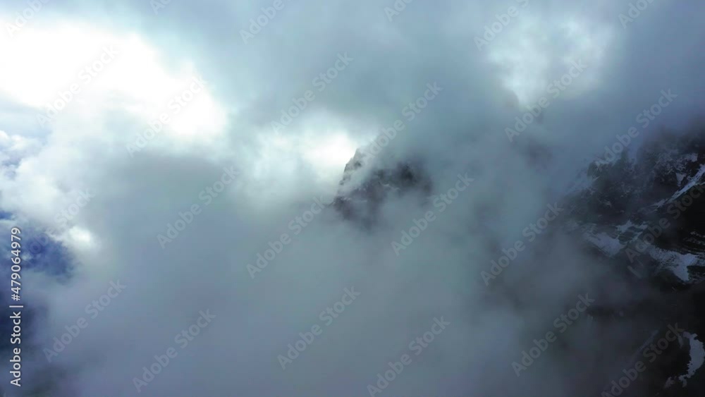 Aerial Scenic View Of Snow Covered Rock Formations With Drone Flying Forward In White Clouds - Savoie, France Aerial Scenic View Of Snow Covered Rock Formations With Drone Flying Forward In White Clouds - Savoie, France