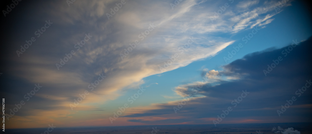 heavenly clouds in blue sky white and grey colors in clouds parted to reveal blue sky in heavens above layers fo puffy white clouds high above the horizon in day time horizontal format religious feel heavenly clouds in blue sky white and grey colors in clouds parted to reveal blue sky in heavens above layers fo puffy white clouds high above the horizon in day time horizontal format religious feel