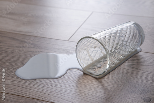 milk spilled on the floor, waterproof laminate, concept
