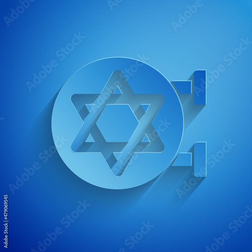 Paper cut Jewish synagogue building or jewish temple icon isolated on blue background. Hebrew or judaism construction with David star. Paper art style. Vector