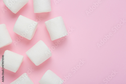 Marshmallows frame on pink background, top view with empty space for text 