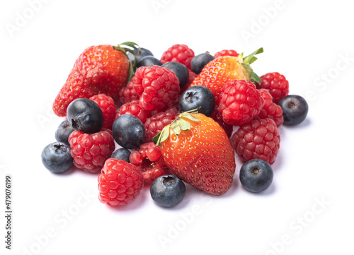 Raspberries, strawberries and blueberries isolated over white background