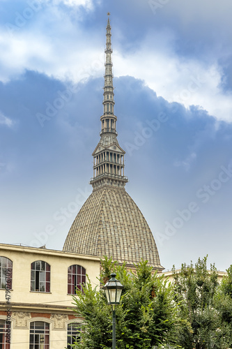 Turin, Mole Antonelliana building in Turin, Italy, street lamp in the foreground.