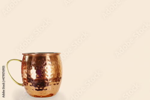 Photography moscow mule copper cocktail mug isolated on cream pink background