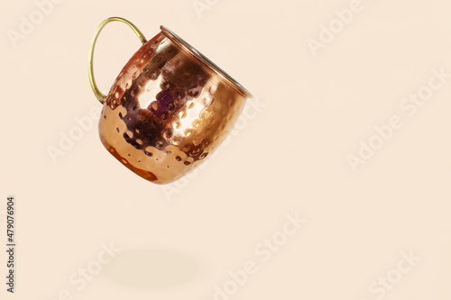 Photography moscow mule copper cocktail mug isolated on cream pink background