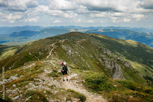 Hiker on the top in Carpathians mountains. Travel sport lifestyle concept. © volody10