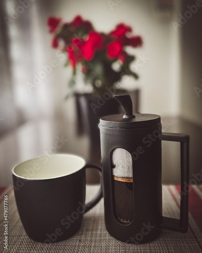 French press and coffee mug