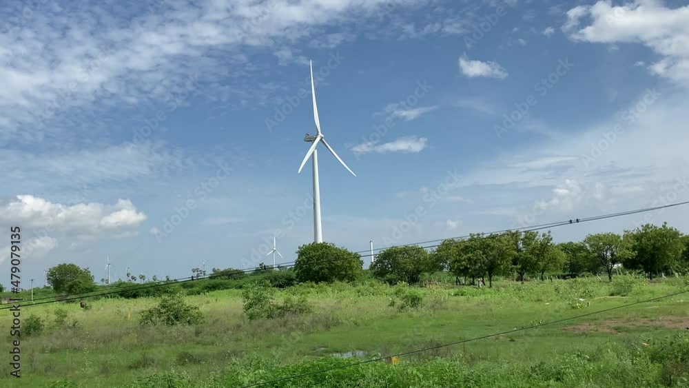 wind turbine in the field, windmills for renewable electric energy production, Alternative renewable power generation, green energy concept. wind turbine in the field, windmills for renewable electric energy production, Alternative renewable power generation, green energy concept.