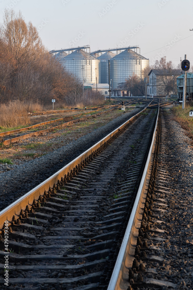 Obraz premium railway track near the factory. Autumn trees and factory premises