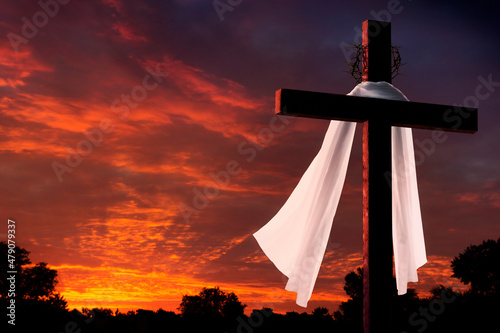 Obraz na plátne This dramatic sunrise lighting and Easter Cross makes a great Easter photo illustration of Jesus dying on the cross and rising again