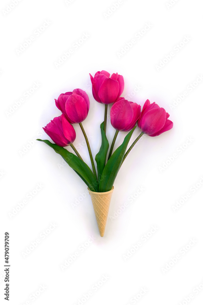 Pink tulips in waffle cone on white background with space for text. Top view, flat lay