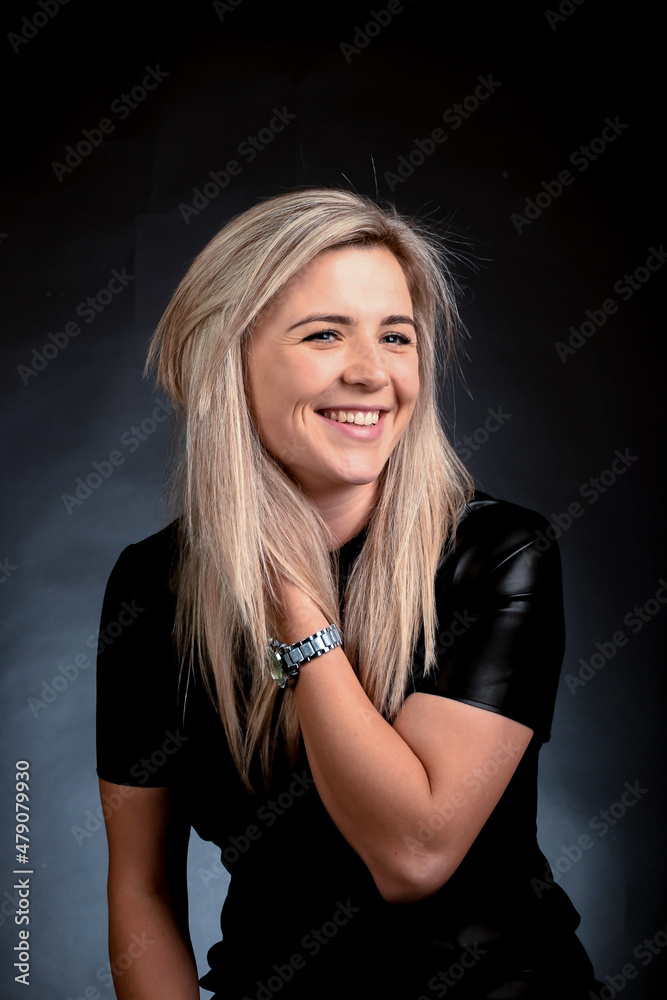 Young Caucasian blonde woman looking at camera and smiling white-toothed smile Young Caucasian blonde woman looking at camera and smiling white-toothed smile