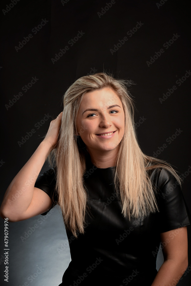 Young Caucasian blonde woman looking at camera and smiling white-toothed smile Young Caucasian blonde woman looking at camera and smiling white-toothed smile