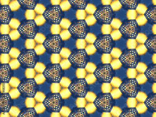 Repeating kaleidoscopic pattern with abstract flowers and light effects. A yellow/navy pattern for surface design. Concept of night and lighting. Concept of the dark and the light.