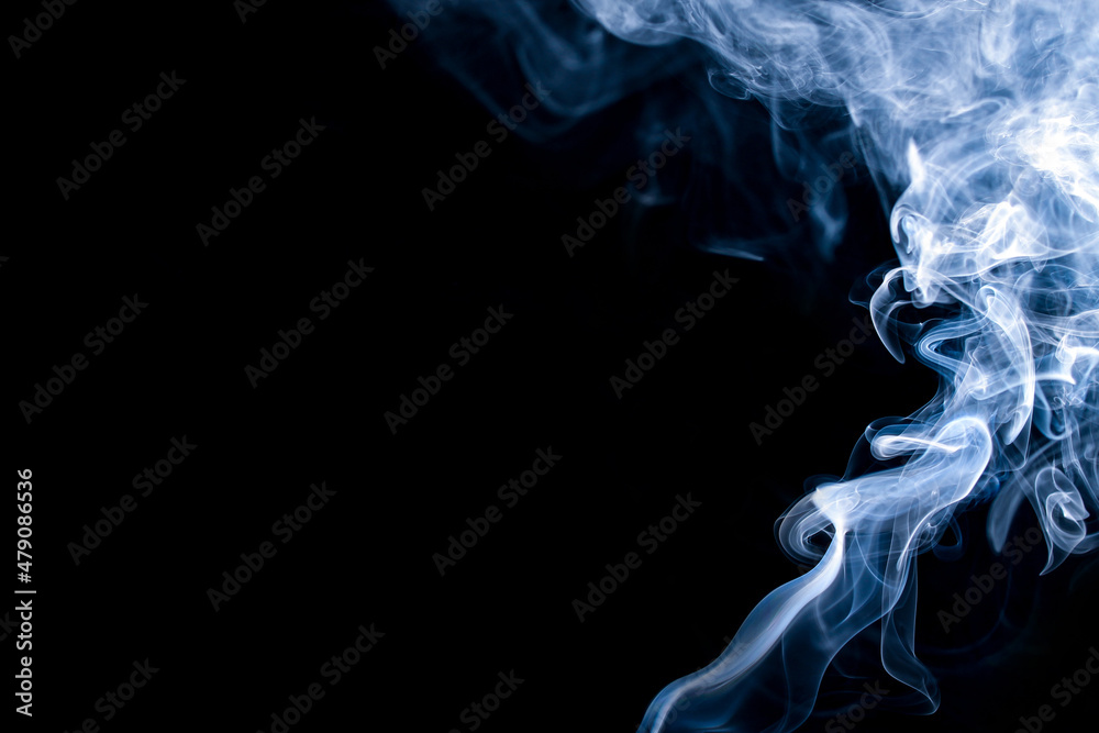 Fototapeta premium Abstract blue smoke on a dark background. Blue smoke background
