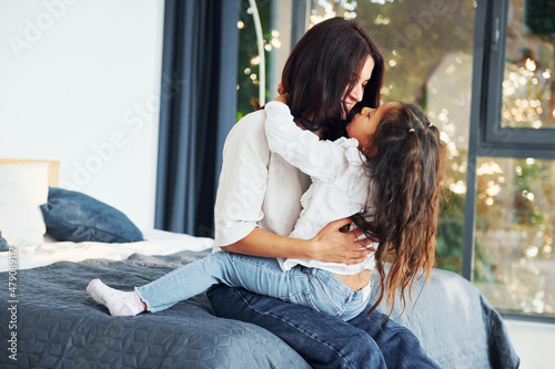 Love of child and parent. Mother and her daughter spending time together at home