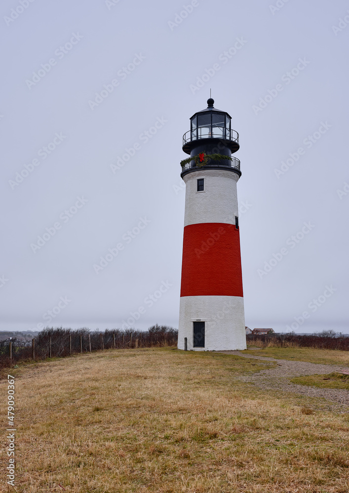 The Sankaty  Head Coast Guard Lighthouse on the island of Nantucket on a drizzly and foggy day