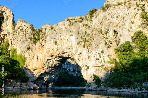 The Pont dArc in the Ardeche gorges in the middle of nature in Europe, France, Ardeche, in summer, on a sunny day.