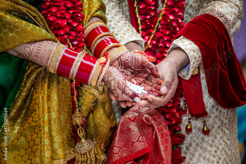 Indian Hindu wedding ceremony ritual items, hands and feet close up