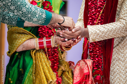 Indian Hindu wedding ceremony ritual items, hands and feet close up © Stella Kou