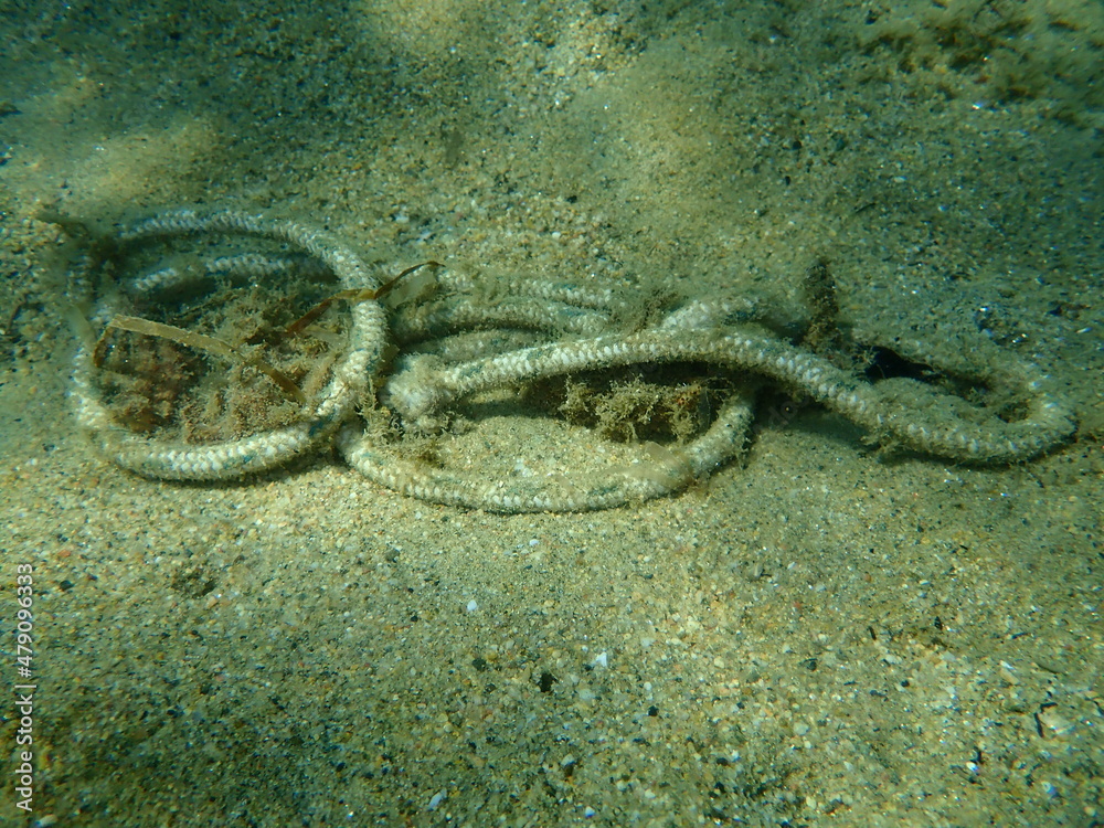 Rope underwater, Aegean Sea, Greece, Halkidiki. Sea pollution.