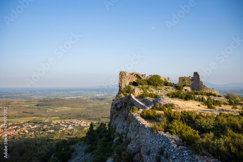 The Chateau de Opoul Perillos sits on its rocky cliff in Europe  France  Occitanie  the Pyrenees Orientales  in summer  on a sunny day.