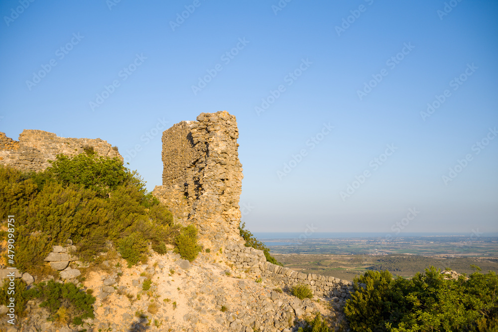 The ruined tower of Chateau de Opoul Perillos in Europe, France, Occitanie, Pyrenees Orientales in summer on a sunny day.