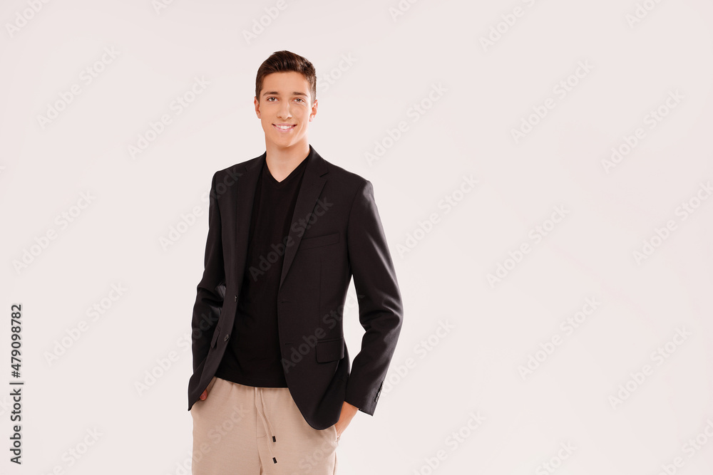 Portrait of smiling, handsome teenage boy in elegant clothes . Studio shot. Teen fashion. Real people emotions. Portrait of smiling, handsome teenage boy in elegant clothes . Studio shot. Teen fashion. Real people emotions.