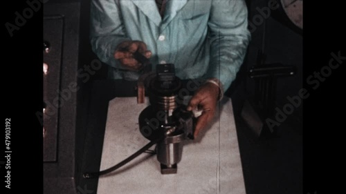 Solenoid Demonstration 1967 - A technician demonstrates the funtion of an industrial solenoid in 1967. photo