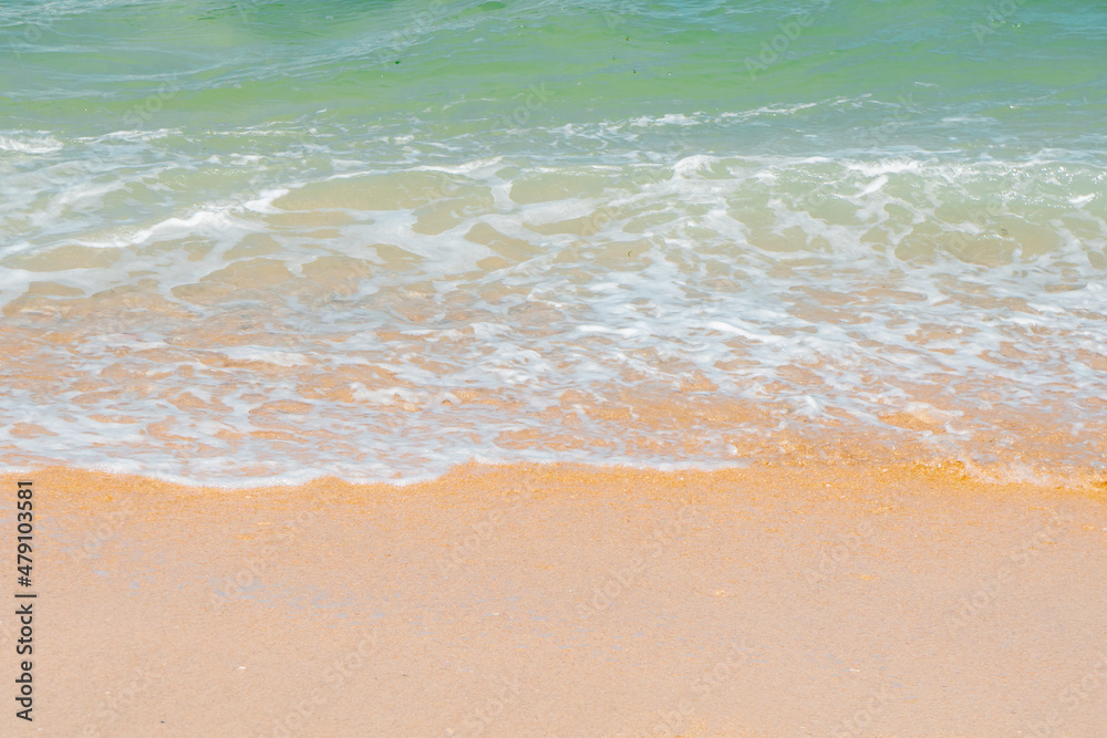 Close up, beach with small waves and clean sand