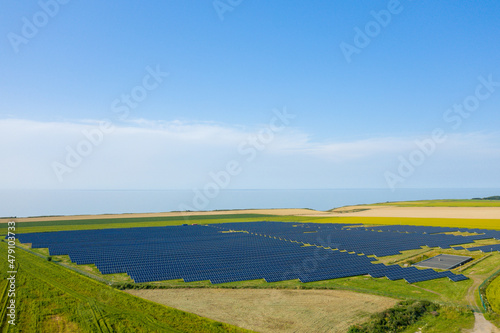 Norman Solar Panels at the edge of the cliffs and the Channel Sea in Europe, France, Normandy, in summer on a sunny day.