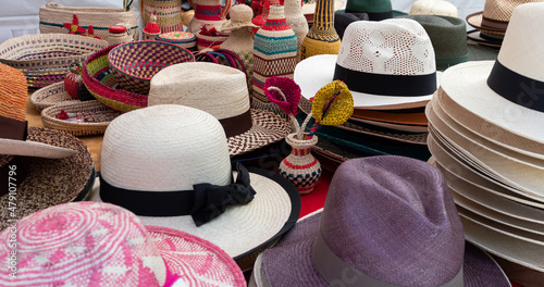 Authentic handmade straw Panama Hats or Paja Toquilla hats or sombreros at the traditional outdoor market in Cuenca, Ecuador. Popular souvenir from South America