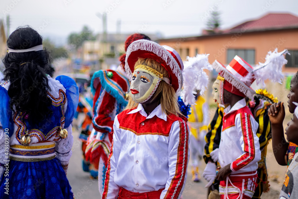 Portrait of a Masquerade and fancy dressed person during a festival in Ghana