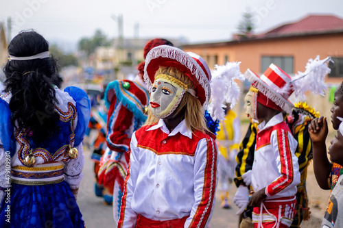 Portrait of a Masquerade and fancy dressed person during a festival in Ghana