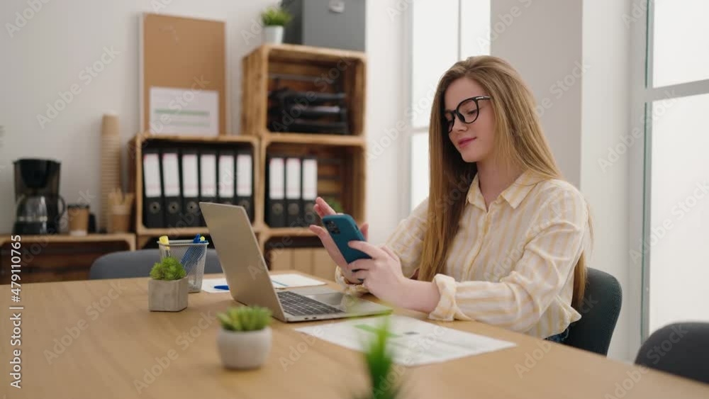 Young blonde woman business worker using smartphone working at office Young blonde woman business worker using smartphone working at office