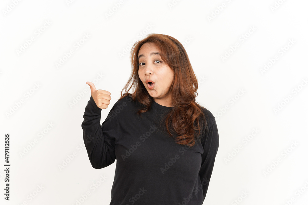 Pointing to Product Using Thumb Of Beautiful Asian Woman Wearing Black Shirt Isolated On White Pointing to Product Using Thumb Of Beautiful Asian Woman Wearing Black Shirt Isolated On White
