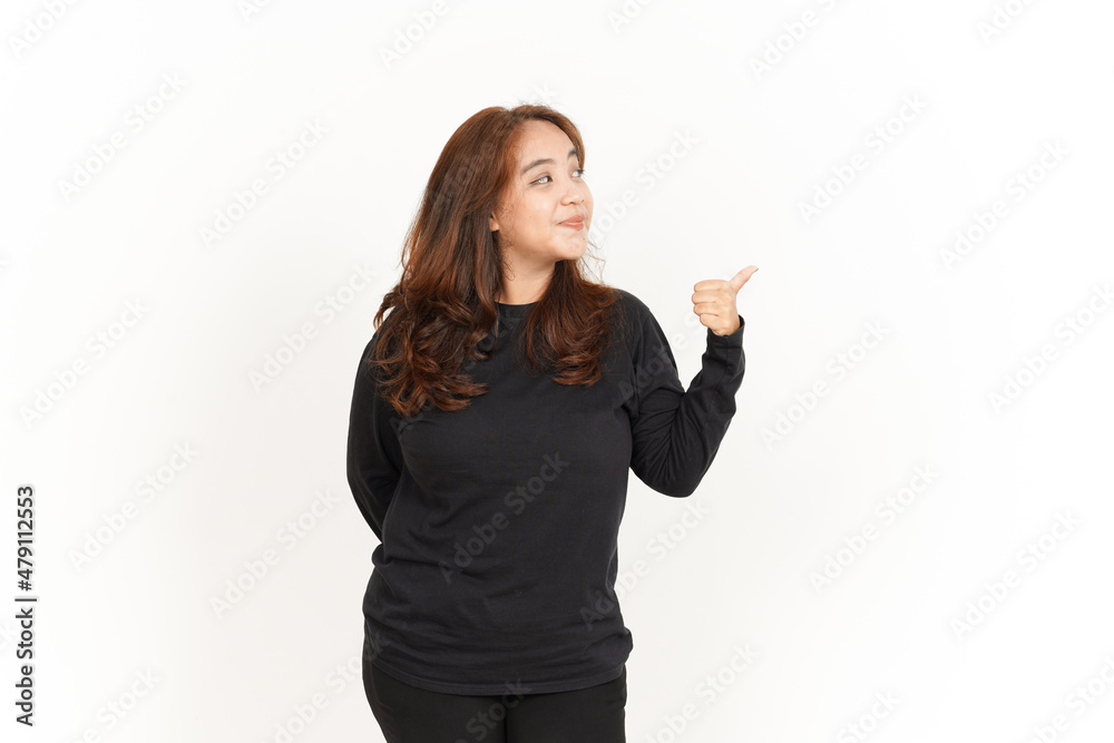 Pointing to Product Using Thumb Of Beautiful Asian Woman Wearing Black Shirt Isolated On White Pointing to Product Using Thumb Of Beautiful Asian Woman Wearing Black Shirt Isolated On White