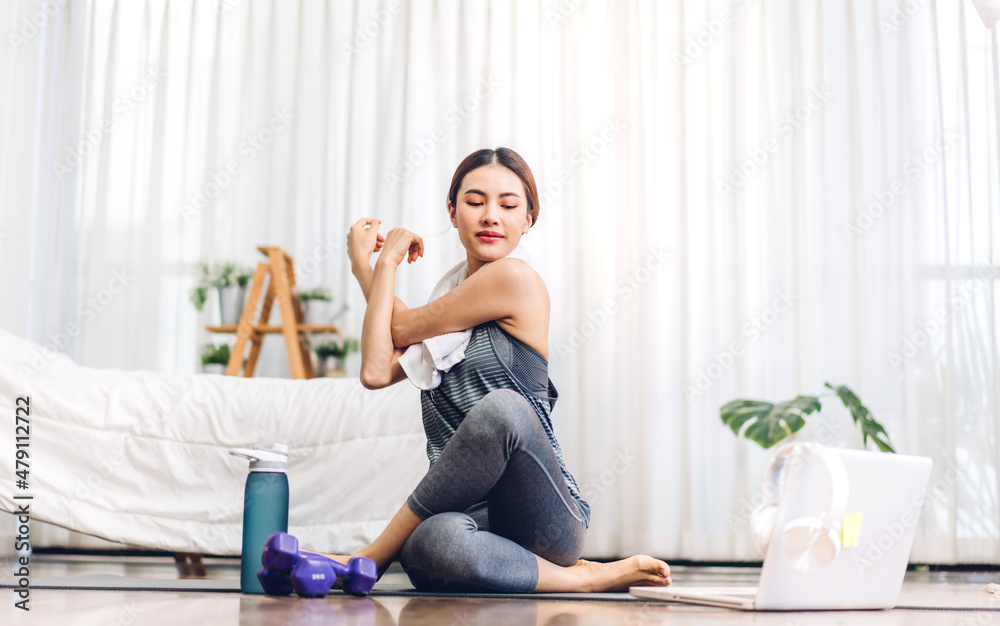 Portrait sport asian beauty body slim woman in sportswear sitting relax and girl practicing yoga and do fitness exercise with laptop computer in bedroom at home.Diet concept.Fitness and healthy Portrait sport asian beauty body slim woman in sportswear sitting relax and girl practicing yoga and do fitness exercise with laptop computer in bedroom at home.Diet concept.Fitness and healthy