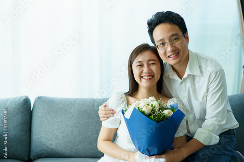 Happy Asian young couple in Valentine or anniversary stay together.