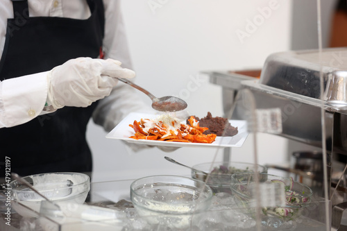 chef serving chilaquiles