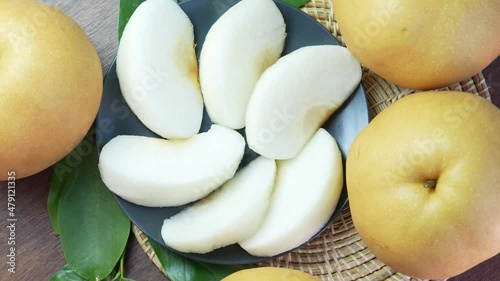 Snow pear fruit on wooden background, Fresh Nashi pear or Korean pear fruit rotation.