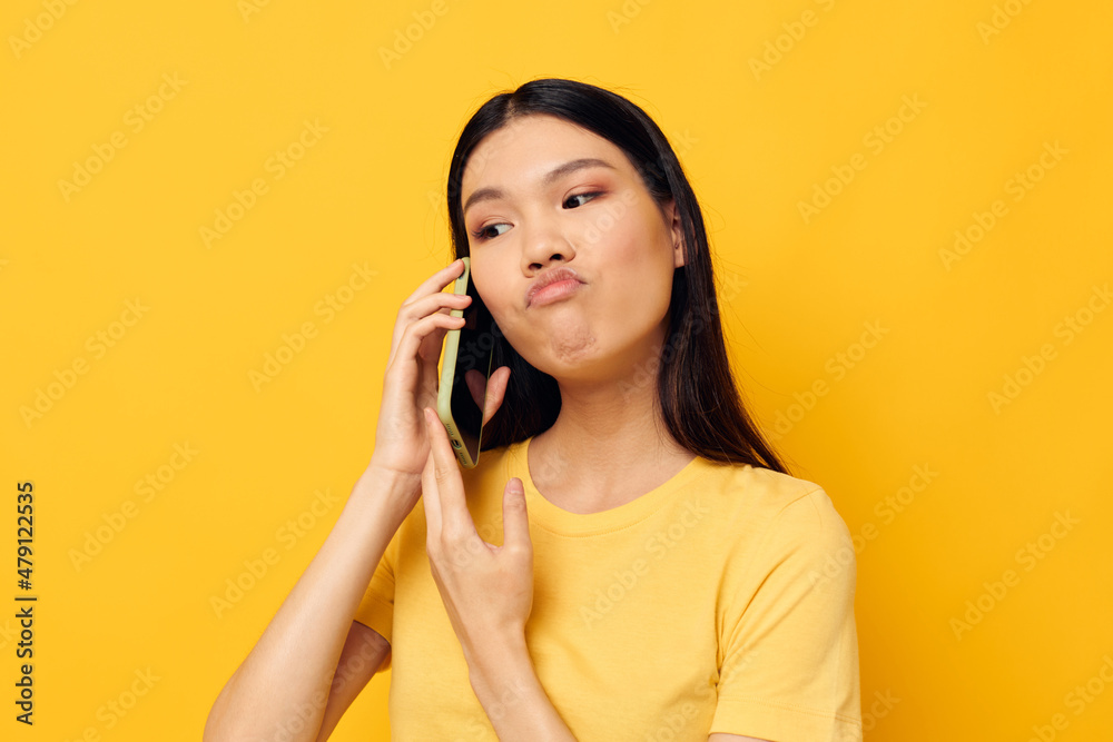 Portrait Asian beautiful young woman phone communication fun use studio model unaltered Portrait Asian beautiful young woman phone communication fun use studio model unaltered