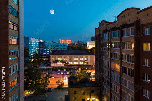 Beautiful aerial view of illuminated apartment buildings and the Regional Clinic Hospital №2 on the Harkovskaya Street in summer day at twilight, Tyumen, Russia
