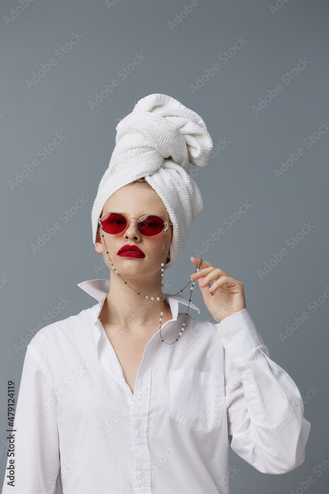 woman with a towel on his head in a white shirt studio model unaltered woman with a towel on his head in a white shirt studio model unaltered